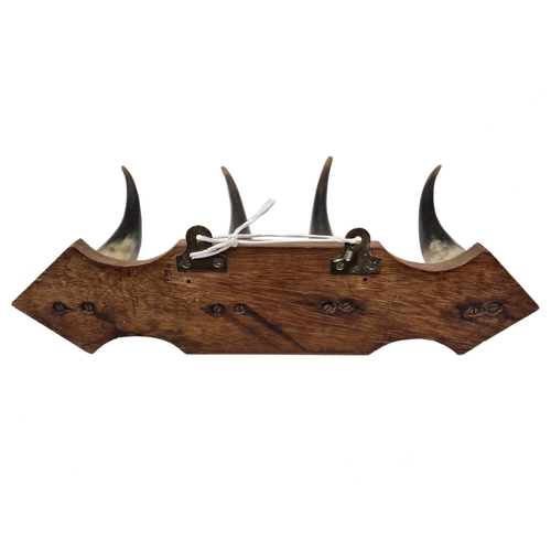 1082 - Black Forest four piece horn coat rack, W 50cm