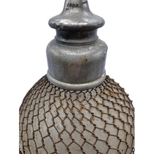 1590 - Early 20th century double gourd soda siphon with wire mesh surround, H 50cm