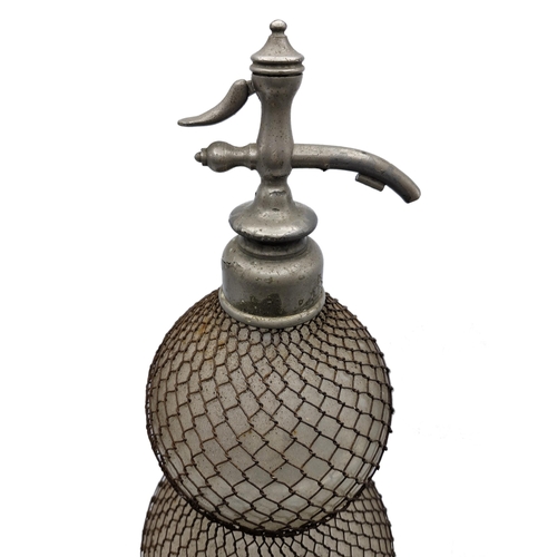 1590 - Early 20th century double gourd soda siphon with wire mesh surround, H 50cm