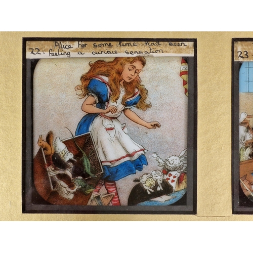 1449 - Set of twelve Alice In Wonderland coloured magic lantern slides, 47cm x 42cm, framed