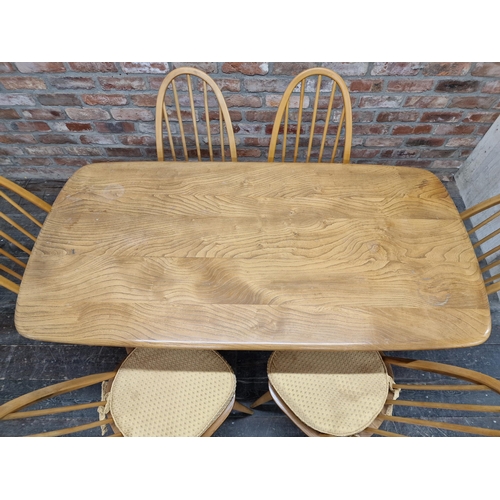 1261 - Ercol - Vintage light elm dining table, H 71cm x W 150cm x D 76cm together with a set of six light e... 