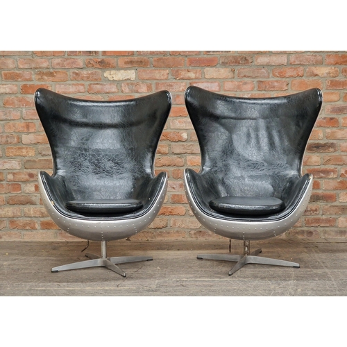 1276 - After Arne Jacobsen - Pair of EGG aviator swivel chairs with black leather upholstery, H 110cm (2)