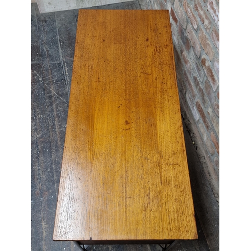 1166 - Vintage Danish teak low desk in the manner of Heinrich Roepstorff with two drawers raised on tubular... 