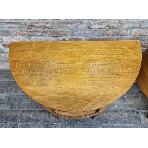 1177 - Pair of contemporary oak demi lume hall tables with central open cupboard, H 77cm x W 82cm x D 44cm ... 