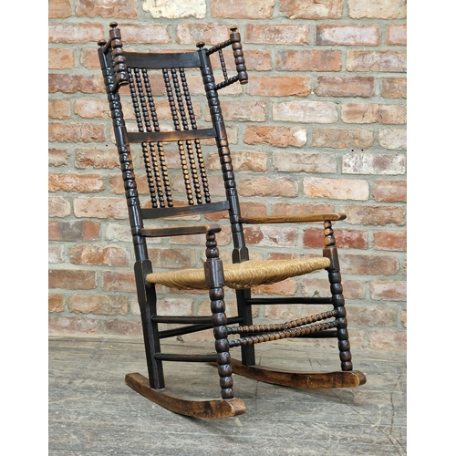 1218 - Manner of Ernest Gimson (British, 1864-1919) -  Arts and Crafts stained ash rocking chair with bobbi... 