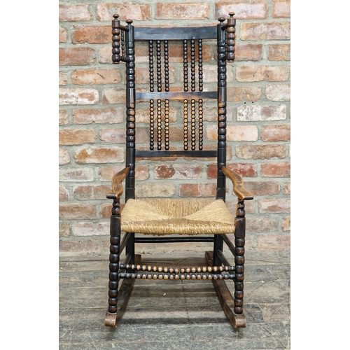 1218 - Manner of Ernest Gimson (British, 1864-1919) -  Arts and Crafts stained ash rocking chair with bobbi... 