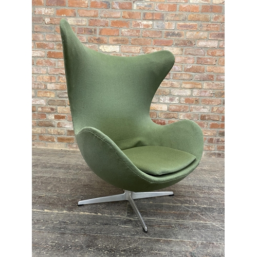 1328 - Arne Jacobsen (1902-1971) - Egg Chair, original green upholstery on cast aluminium base, H 106cm x W... 