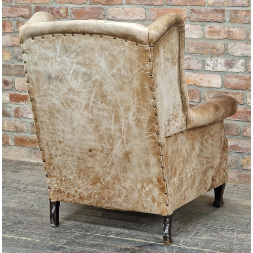 1283 - Vintage studded leather wingback armchair, H 96cm