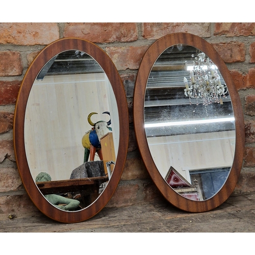 1318 - Pair of vintage oval teak framed mirrors, H 57cm x W 37cm (2)