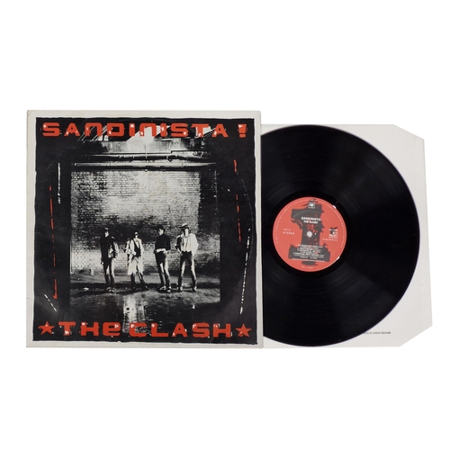 326 - The Clash, The Sandinista triple album, vinyl appears excellent, cover VG+, magazine included