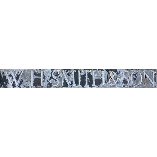 1073 - Advertising - large W.H Smith & Sons lead street sign, 88cm x 20cm