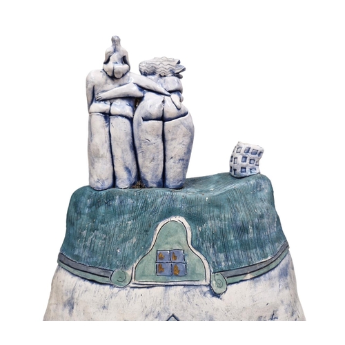 1612 - Large studio pottery sculpture of a nude family of the roof of a house, 55cm high