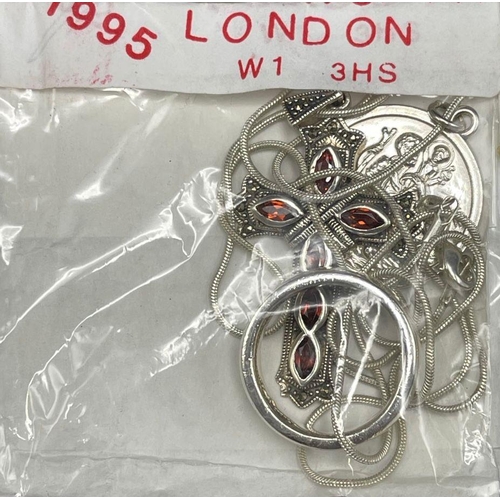 454 - Reggie Kray - Four pieces of silver jewellery, to include necklace, ring, garnet cross and St Christ... 