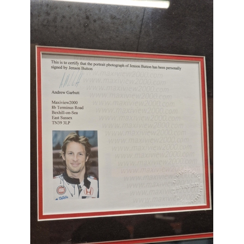 522 - Jenson Button Honda Racing team shirt and signed photograph, in large presentation frame with authen... 