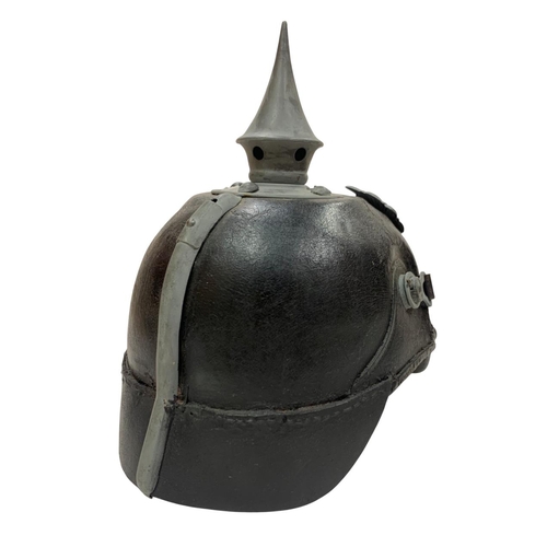 223 - WWI Imperial German Army pickelhaube uniform helmet, having a leather construction with nickel front... 