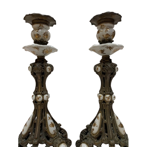 1110 - Pair of 19th century bronze candlesticks, having pierced stem and scallop shell base with hand paint... 