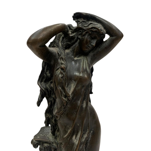 453 - Heavy bronze figure of bathing maiden against column, held atop circular marble base, H 31cm