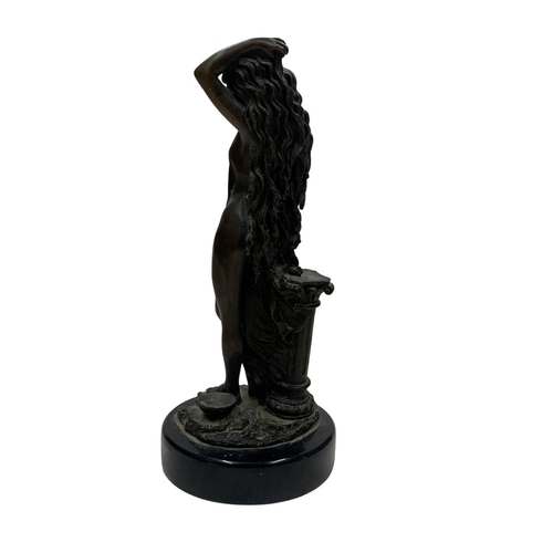 453 - Heavy bronze figure of bathing maiden against column, held atop circular marble base, H 31cm