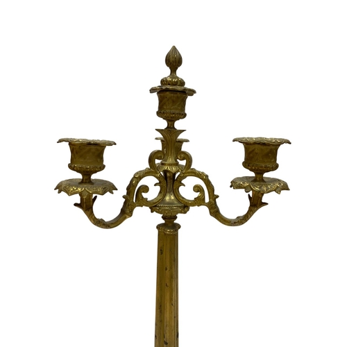 1112 - Pair of French 19th century Charles X gilt bronze four arm candelabra, H 47cm