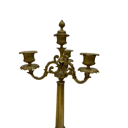 1112 - Pair of French 19th century Charles X gilt bronze four arm candelabra, H 47cm