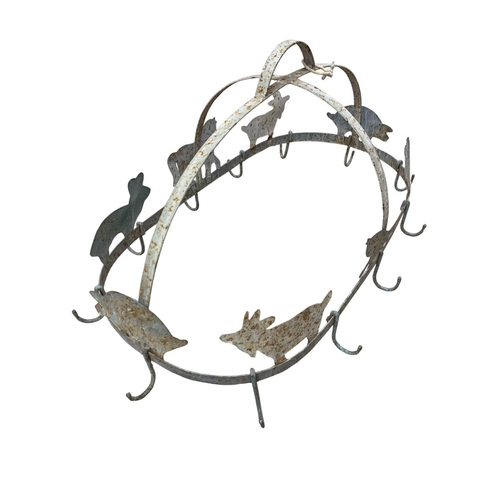 456 - Antique wrought iron twelve hook oval shaped game hanger, having raised farmyard animal decoration t... 