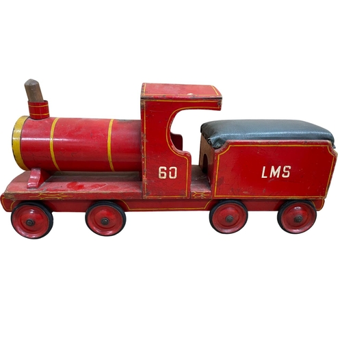 521 - Three hand made wooden toys to include Nicol Toys toy train, L.M.S train and scratch built van, larg... 