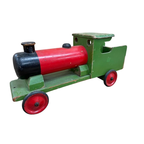 521 - Three hand made wooden toys to include Nicol Toys toy train, L.M.S train and scratch built van, larg... 