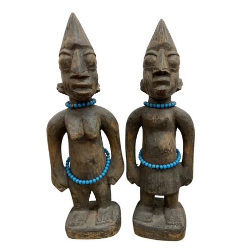 264 - Quantity of African collectables to include Yoruba type carved hardwood twin figures (30m tall), pai... 