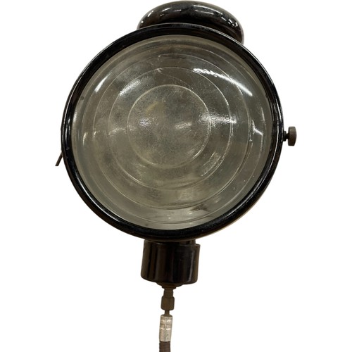 1140 - Black enamel carbide headlamp complete with bracket, diameter 16cm