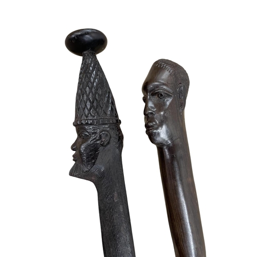 263 - Quantity of African hardwood collectables to include busts, table lamp, walking sticks, etc. (Lamp 4... 