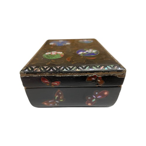 265 - 19th century black lacquered box with butterfly wing circular panels fronted by enamel floral detail... 