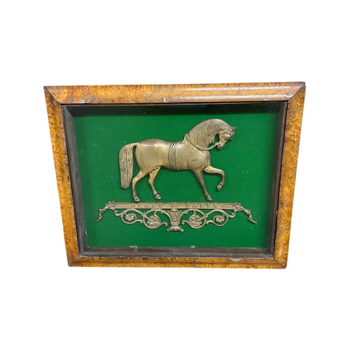 468 - Victorian 'Black Eagle' brass applique modelled as a horse, within a veneered & glazed frame, overal... 