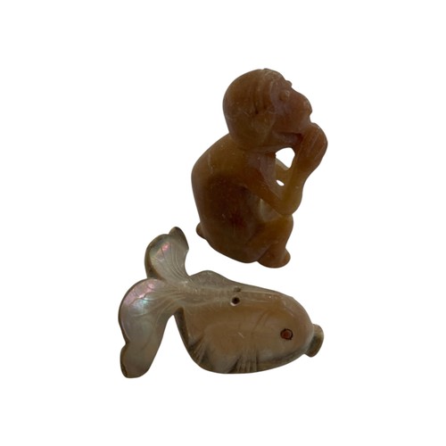 271 - Japanese mother of pearl netsuke in the form of a fish with inset eyes, together with a further soap... 