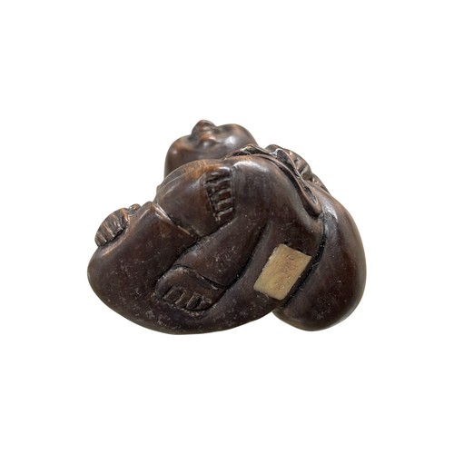 278 - Two Japanese carved netsukes - happy Buddha and sleeping Buddha, both with inset tablet signatures, ... 