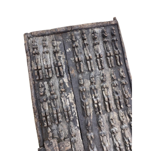 281 - Antique hand carved African tribal Dogan door panel with original latch, carved in relief with bands... 