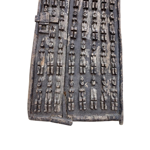 281 - Antique hand carved African tribal Dogan door panel with original latch, carved in relief with bands... 