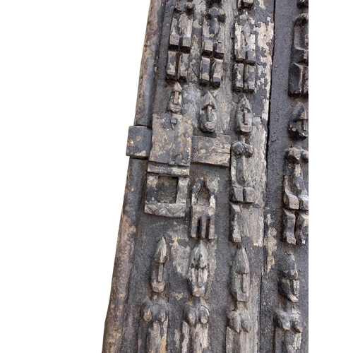 281 - Antique hand carved African tribal Dogan door panel with original latch, carved in relief with bands... 