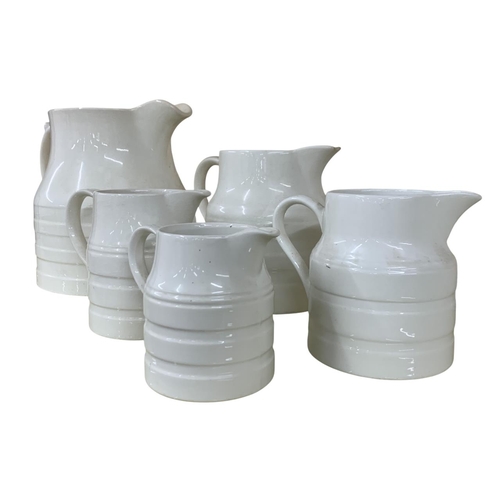 331 - Collection of white banded ceramic kitchen jugs, largest H 23cm (5)