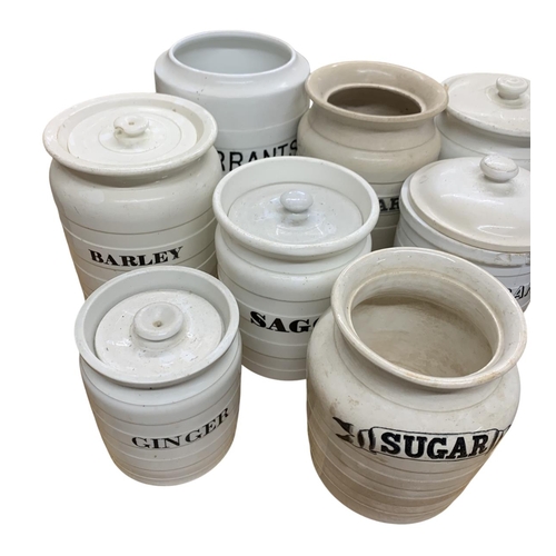 330 - Collection of white banded ceramic kitchen cannisters to include Tapioca. Ground Rice, Currants, Sug... 