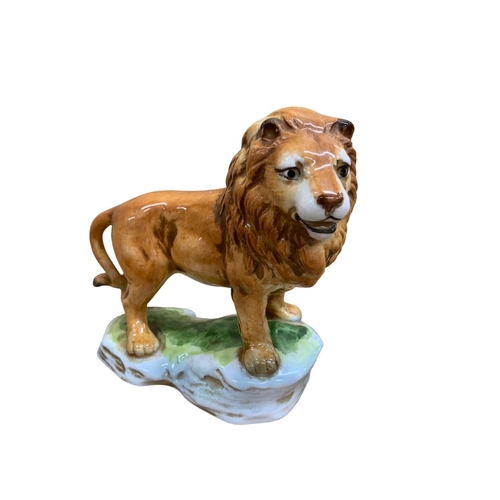 333 - Pair of hand painted Sitzendorf lion figures, stamped to base with mark and 'Lion Felis Leo', H 14cm... 