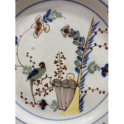 354 - 18th Century Lambeth English Delft plate, polychrome decorated with a bird amongst blossoming branch... 