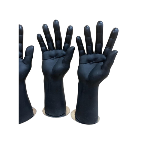 554 - Two pairs of contemporary sculptural male mannequin hands atop magnetic bases, H 30cm