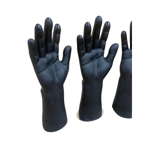 554 - Two pairs of contemporary sculptural male mannequin hands atop magnetic bases, H 30cm