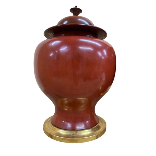 347 - Pair of very large Chinese sang de boeuf ceramic lidded urns on gilt wood stands, H 65cm