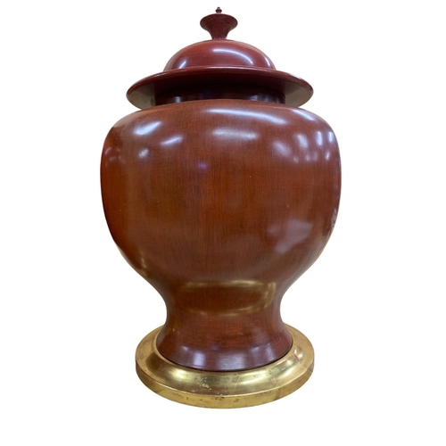 347 - Pair of very large Chinese sang de boeuf ceramic lidded urns on gilt wood stands, H 65cm