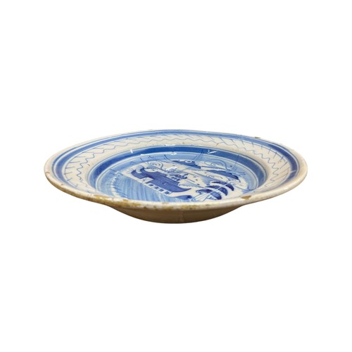 370 - 18th Century Delftware blue and white circular dish with central Chinoiserie pagoda scene, D 33cm