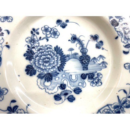 373 - 18th Century Enlgish Delft blue and white plate with chinoiserie floral decoration, repeating border... 