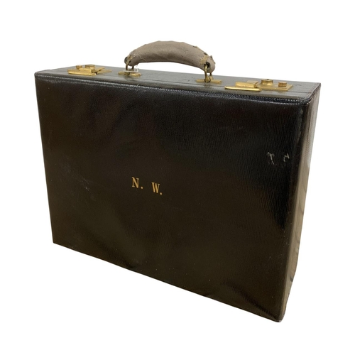 564 - Antique leather and brass clasped vanity case, having initialled 'N.W' to front with fitted leather ... 