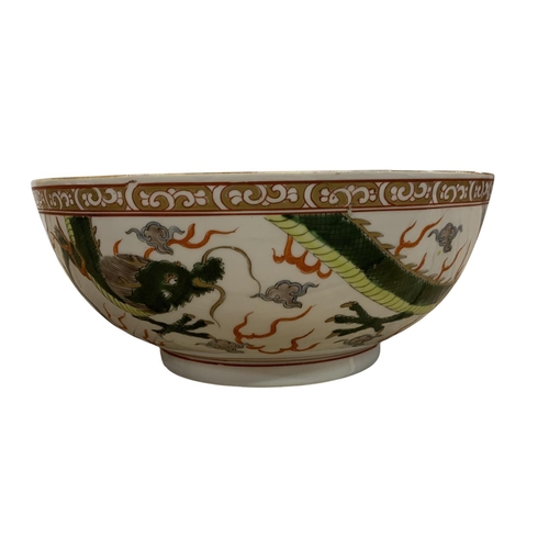 286 - Chinese Famille Verte circular bowl decorated with two flying green dragons among flames and clouds,... 