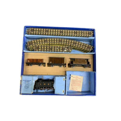 513 - Quantity of vintage boxed Hornby Dublo trains to include  L.M.S 6917 with carriages and tracks and a... 